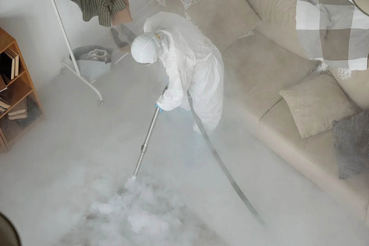 Biohazard cleanup technician in protective equipment, Dayton, WA